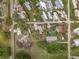 Overhead aerial view showcases homes in a neighborhood offering a unique vantage point of the community at 34828 1St Ave, Leesburg, FL 34788