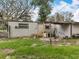 The backyard features ample space and a shed structure, ideal for storage at 34828 1St Ave, Leesburg, FL 34788