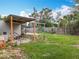 Spacious backyard with a covered area, perfect for outdoor activities and relaxation at 34828 1St Ave, Leesburg, FL 34788