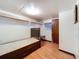 Cozy bedroom with wood floors, a small window, and a bed frame with storage drawers at 34828 1St Ave, Leesburg, FL 34788