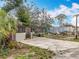 Outdoor view featuring home's exterior, with an extensive parking area at 34828 1St Ave, Leesburg, FL 34788