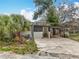 Charming single-story home featuring a carport, well-maintained landscaping, and a cozy entrance at 34828 1St Ave, Leesburg, FL 34788