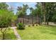 Enjoy the outdoors in this lovely backyard with a screened-in pool and lush landscaping at 4893 Sw 4Th Cir, Ocala, FL 34471