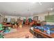 A cluttered basement featuring a bed, sofas, chairs, and boxes at 4893 Sw 4Th Cir, Ocala, FL 34471