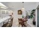 Cozy dining area features a pendant light, wainscoting and views to the backyard at 4893 Sw 4Th Cir, Ocala, FL 34471