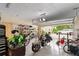 Large, bright garage featuring an epoxy floor, door to back yard and 2 motor cycles at 4893 Sw 4Th Cir, Ocala, FL 34471
