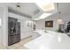 Bright kitchen with stainless appliances, white cabinets, and eat-in breakfast bar at 4893 Sw 4Th Cir, Ocala, FL 34471