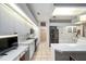 Spacious kitchen features bright white cabinets, stainless appliances, and tile flooring at 4893 Sw 4Th Cir, Ocala, FL 34471