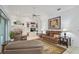 Comfortable living room with neutral tones, fireplace, and built-in shelving at 4893 Sw 4Th Cir, Ocala, FL 34471