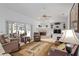 Bright living room with fireplace, built-in shelving, and sliding door to outdoor dining at 4893 Sw 4Th Cir, Ocala, FL 34471