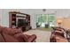 Relaxing living room boasts a large entertainment center and sliding glass doors to the pool area at 4893 Sw 4Th Cir, Ocala, FL 34471
