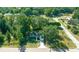Overhead shot showcasing the home's placement in a lush, green, tree-lined neighborhood at 19662 Sw Marine Blvd, Dunnellon, FL 34431