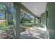Covered porch featuring sturdy support columns, recessed lighting, and a smooth concrete floor at 19662 Sw Marine Blvd, Dunnellon, FL 34431
