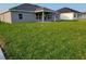 Spacious backyard with lush lawn, ideal for outdoor entertaining and relaxation at 5892 Sw 82Nd Ln, Ocala, FL 34476