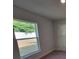 Bright bedroom with a large window and neutral-toned walls offering natural light at 5892 Sw 82Nd Ln, Ocala, FL 34476