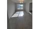 Bright dining room with neutral walls, tile floors, and natural light coming through the window at 5892 Sw 82Nd Ln, Ocala, FL 34476