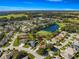 Aerial view of a single-Gathering home in a golf course community at 7290 Se 172Nd Legacy Ln, The Villages, FL 32162