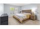 Bright bedroom featuring tile floors, neutral paint, and plantation shutters at 7290 Se 172Nd Legacy Ln, The Villages, FL 32162