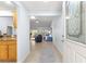 Inviting entryway with decorative glass door, neutral tile flooring and an open view to living area at 7290 Se 172Nd Legacy Ln, The Villages, FL 32162