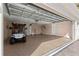 Spacious garage with an epoxy floor, and golf cart parked inside at 7290 Se 172Nd Legacy Ln, The Villages, FL 32162