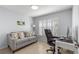 Comfortable office space with a neutral toned sofa and large chair at 7290 Se 172Nd Legacy Ln, The Villages, FL 32162