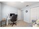Bright home office features ample seating with a pull out sofa bed, workspace, and closet at 7290 Se 172Nd Legacy Ln, The Villages, FL 32162