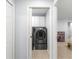 This shows an alcove laundry room with gray washer and dryer at 7290 Se 172Nd Legacy Ln, The Villages, FL 32162