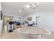 Open living area features bar seating, tile floors, and access to dining area at 7290 Se 172Nd Legacy Ln, The Villages, FL 32162