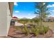 Landscaped backyard with patio, grill, mulch beds, and lovely vegetation for a serene outdoor space at 9617 Sw 102Nd Ter, Ocala, FL 34481