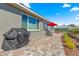 Charming backyard patio featuring a grill, dining set, and well-maintained landscaping at 9617 Sw 102Nd Ter, Ocala, FL 34481