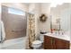 Well-lit bathroom features a tub, shower, and modern granite-topped vanity at 9617 Sw 102Nd Ter, Ocala, FL 34481