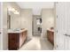 Spacious bathroom featuring dual vanities, tile floors, and neutral wall color at 9617 Sw 102Nd Ter, Ocala, FL 34481