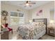 Cozy bedroom with a queen bed, soft carpet, and natural light, perfect for relaxation at 9617 Sw 102Nd Ter, Ocala, FL 34481
