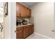 Butler's pantry with granite countertops and storage cabinets at 9617 Sw 102Nd Ter, Ocala, FL 34481