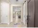 Bright and inviting foyer with neutral tones, tile floors, and a view into the living spaces at 9617 Sw 102Nd Ter, Ocala, FL 34481