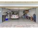 Spacious garage featuring epoxy flooring, organized storage, and ample parking at 9617 Sw 102Nd Ter, Ocala, FL 34481