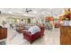 Expansive living area showcasing an open layout with a gourmet kitchen, dining, and comfortable seating at 9617 Sw 102Nd Ter, Ocala, FL 34481