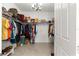 Organized walk-in closet with shelving and rods for ample storage space at 9617 Sw 102Nd Ter, Ocala, FL 34481