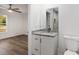 Bathroom with granite vanity, toilet and view of bedroom at 13526 Sw 106Th Pl, Dunnellon, FL 34432