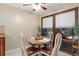 Bright dining area featuring table, chairs, and a large window for lots of natural light at 19660 Sw 83Rd Place Rd # C18, Dunnellon, FL 34432