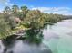 Beautiful waterfront park featuring a dock, lush greenery, and a gazebo at 19660 Sw 83Rd Place Rd # C18, Dunnellon, FL 34432