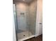 Beautiful glass shower with tiled walls and a niche for toiletries, complemented by stylish flooring at 4557 Ne 31St St, Ocala, FL 34470