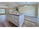 Kitchen island features granite countertops, ample storage, and open floor plan at 9285 Se Highway 42, Summerfield, FL 34491