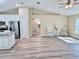 Spacious living area with stainless steel appliances, a kitchen island, and hardwood floors at 9285 Se Highway 42, Summerfield, FL 34491