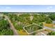 Aerial view highlighting a vacant lot, showcasing its location near a railway and road at Tbd Dogwood Drive Pass # Lot 22, Ocala, FL 34472