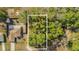 Aerial view of a vacant lot next to a house, surrounded by lush greenery at Tbd Dogwood Drive Pass # Lot 22, Ocala, FL 34472