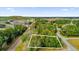 Aerial view of a vacant lot with surrounding trees and nearby houses at Tbd Dogwood Drive Pass # Lot 22, Ocala, FL 34472