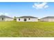 Spacious green backyard with a patio off the back of the house at 14363 Sw 27 St, Ocala, FL 34481
