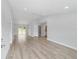 Bright living room with vaulted ceilings, recessed lighting, and sliding glass doors to the backyard at 14363 Sw 27 St, Ocala, FL 34481