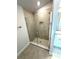 Modern tiled walk-in shower with glass door and built in niche at 3106 Ne 46Th Ave, Ocala, FL 34470